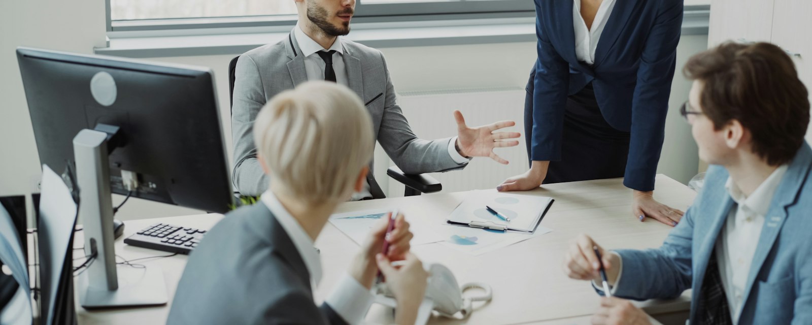 Colleagues in a strategy discussion around a table